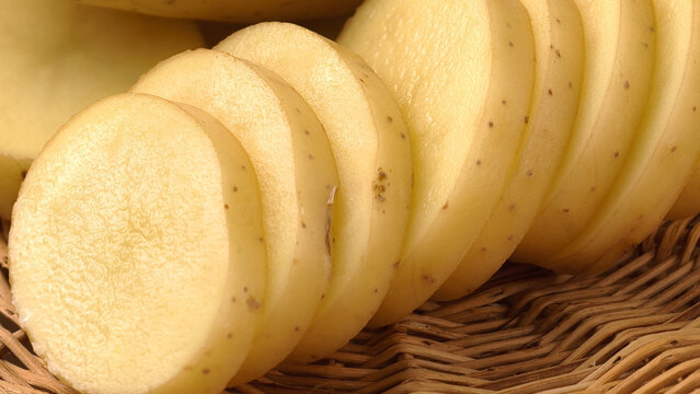 Fresh sliced potatoes in a basket