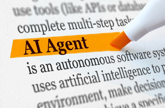 AI Agent term highlighted in orange marker in text with autonomous software system definition, artificial intelligence concept