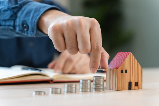 the person putting coin into piggy bank to save money and invest for growth in future.