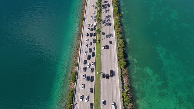 MIami, FLorida, USA - July 24, 2025: Urban roadway. MacArthur Causeway. Roadway Downtown Miami to Miami Beach. Car traffic road highway. Urban traffic. Road way many car. Cars on causeway road