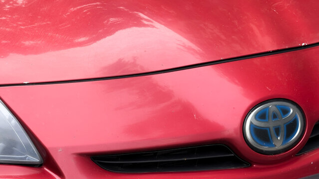 Toyota Prius Hybrid vehicle front design with brand logo, representing modern automotive technology and eco friendly transportation