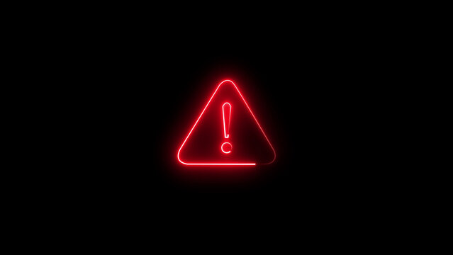 Small glowing red neon warning triangle symbol with an exclamation mark inside, isolated on a dark black background, indicating danger or alert