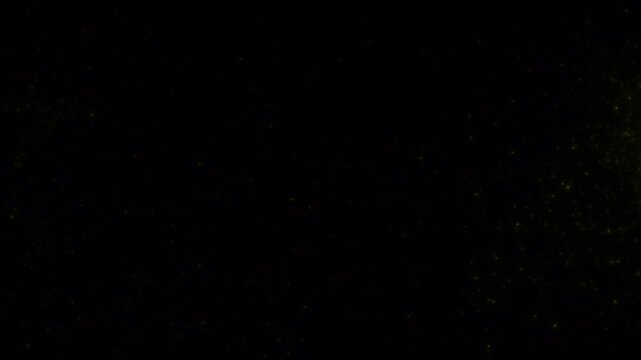 Dark abstract background with slow shifting yellow light flares.
