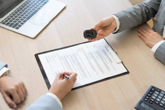 Business transport car, sell service, hand of agent dealer, sale giving auto key vehicle to customer after sign on lease paperwork, document contract with buyer young woman client transfer automobile.