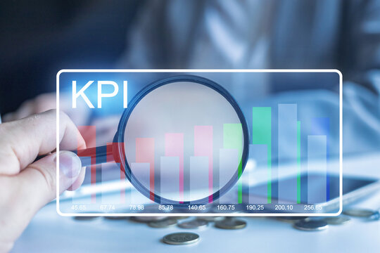 Understanding key performance indicators through data analysis and visual charts with a magnifying glass