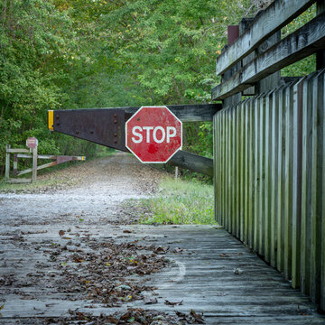 stop sign at Katy Trail in Missouri, in early fall scenery - 237 mile bike trail converted from an old railroad
