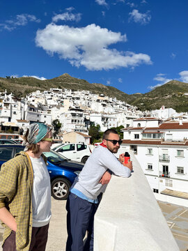 Travelers Overlooking White Village in C&oacute;mpeta