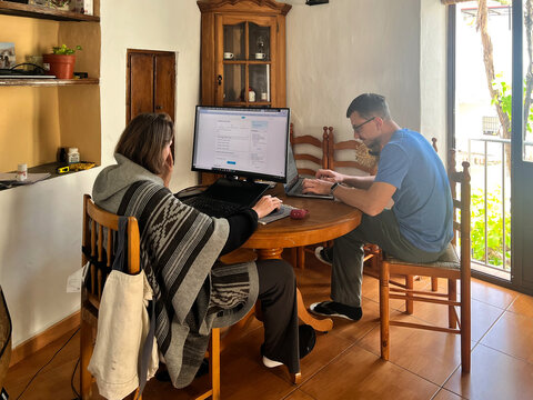 Friends Working From a Rustic Vacation Rental