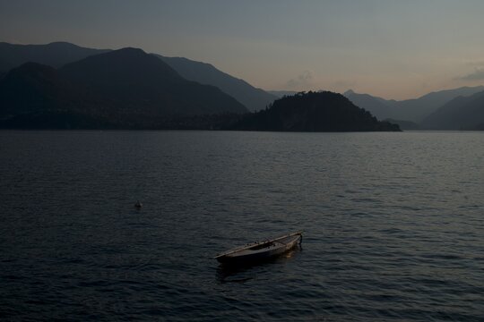 Canoeing On The Lake Among The Mountains