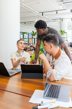 Group of People Working Together in an Office on a Project