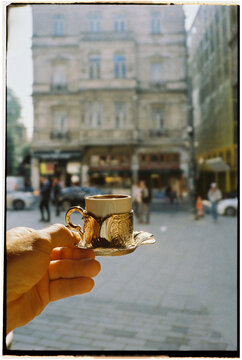 Person takes a cup of Turkish coffee 