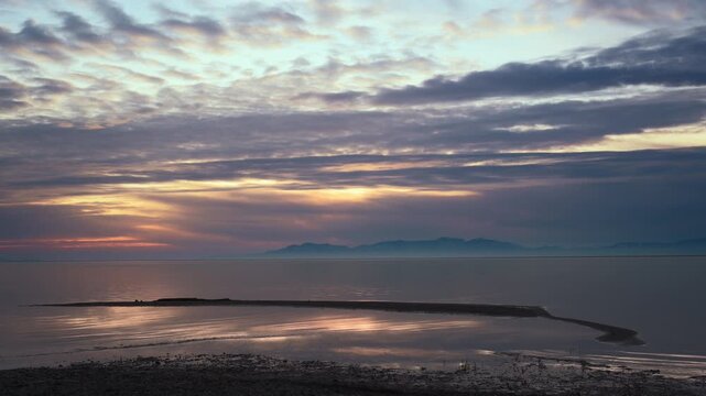 A composite video showing fast motion clouds and normal speed foreground over Willard Bay near Ogden Utah.