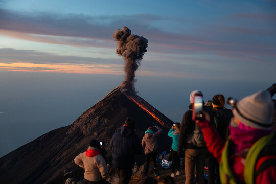 Tourists capturing eruption of Volc&aacute;n de Fuego on camera