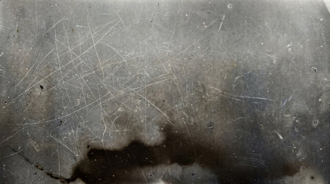 Grungy scratched metal texture background, distressed silver steel surface, industrial weathered backdrop for design and overlays