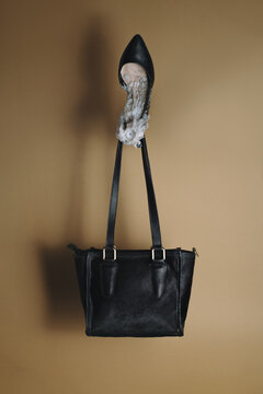 Floating Black High Heel with Melted Candle Wax and Handbag