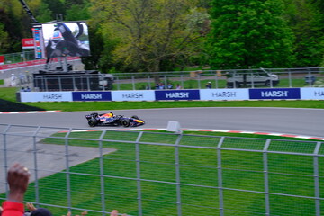 Obraz premium May 24, 2025, Montreal, Canada: Red Bull Racing Formula 1 car during by Hadjar or Verstappen, demonstration run at Circuit Gilles Villeneuve. g.