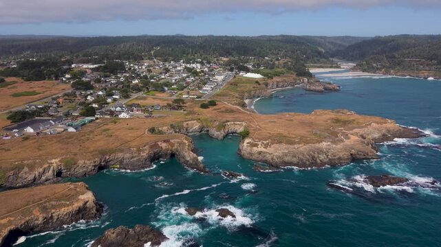 Aerial views highlight Mendocino in California with its coastline and the music festival taking place in the town.