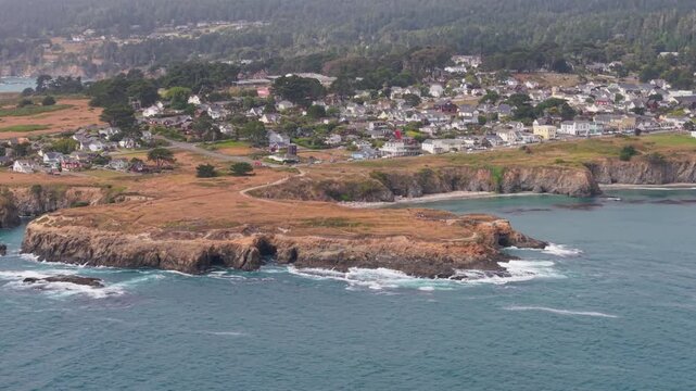 Discover aerial views of Mendocino California showing its rugged coastline and the music festival tent set in the village