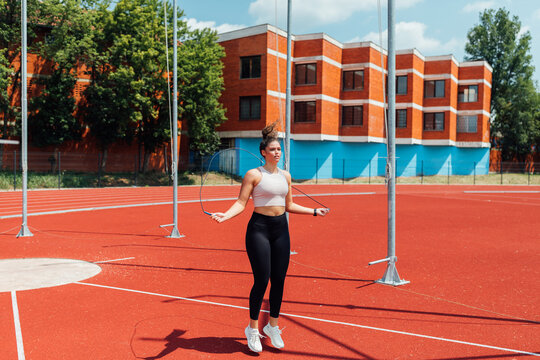 Woman Jumping Rope on Stadium