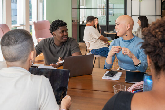 Group of People Having a Discussion in a Shared Office Space