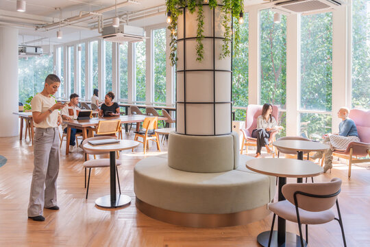 People Working and Relaxing in a Modern Office