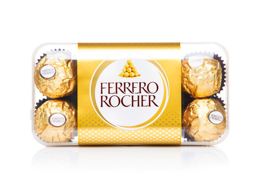 LONDON, UK - DECEMBER 22, 2024: Box of Ferrero Rocher candies with hazelnut and chocolate cream on white background.