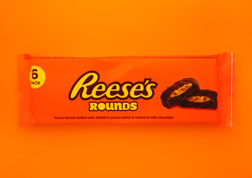 LONDON, UK - DECEMBER 14, 2024: Reese's biscuit rounds with peanut butter on orange background.