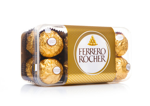 LONDON, UK - DECEMBER 22, 2024: Box of Ferrero Rocher candies with hazelnut and chocolate cream on white background.