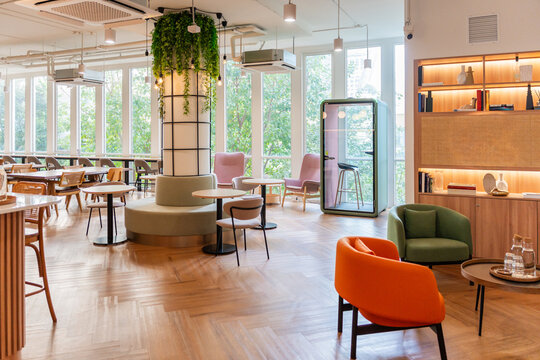 Modern Office With Seating and Natural Light in the Background