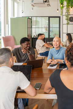 Group of Happy People Talking and Working in a Modern Office Space