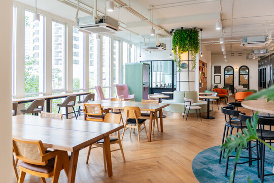 Cozy Workspace With Tables and Chairs During Daytime in a City