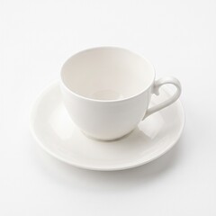 Fototapeta premium White ceramic teacup and saucer on white background