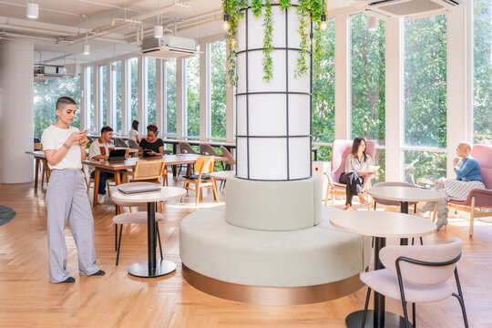 Colleagues Working and Socializing in a Modern Indoor Space