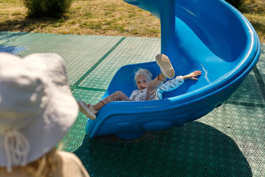 little girl slid down the spiral slide