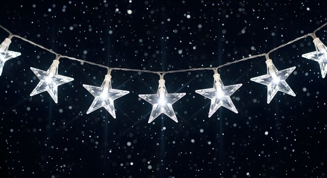 Glowing star shaped fairy lights hanging on a dark background with falling snow