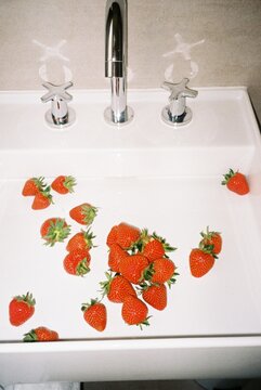 strawberries in a White Sink