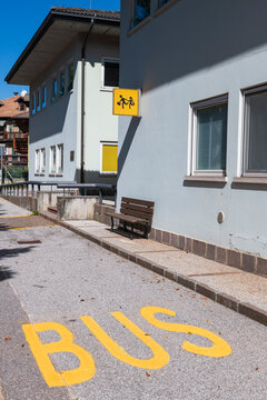 Italian Village Bus Stop With School Children Warning Sign