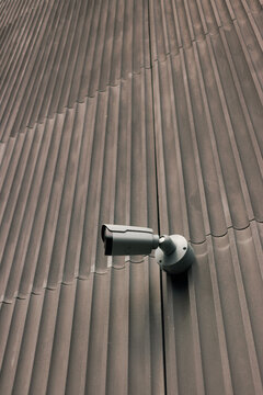 Camera Mounted on Wall Recording Area During Daytime Hours