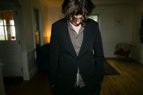 teen boy trying on a new suit 