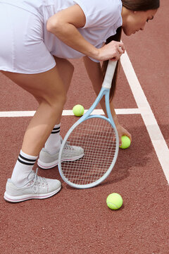  Woman catching a tennis ball
