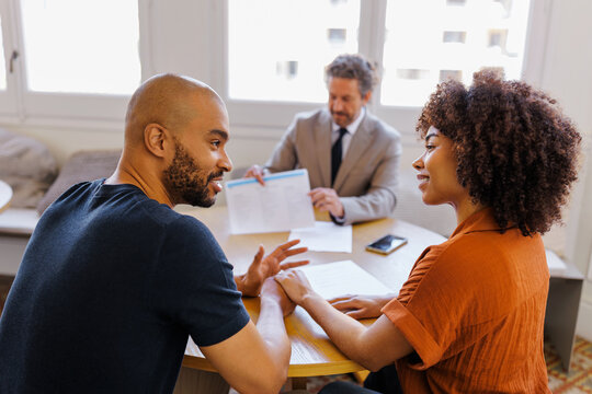 Couple consulting financial advisor about future plans