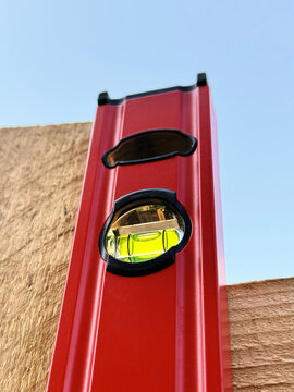 Reno DIY Spirit Level On Timber Fence During Construction Project
