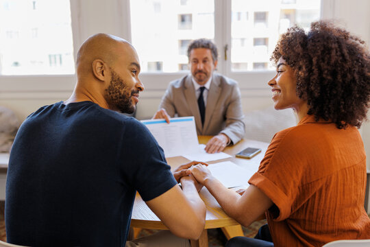 Couple receiving financial advice from professional advisor