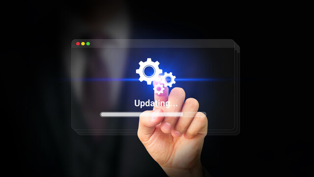 Digital Software Update and Technology Upgrade Concept. Businessman Touching Update Progress Interface on Virtual Screen. Maintenance, System Security Patch, Application Enhancement, New Features.