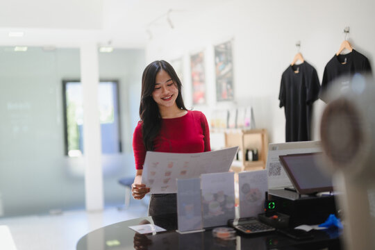 Young woman client looking at menu at counter