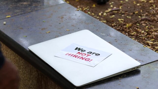 We Are Not Hiring Sign on Laptop Keyboard &ndash; Recruitment Freeze, Job Market Slowdown and Business Downsizing Concept