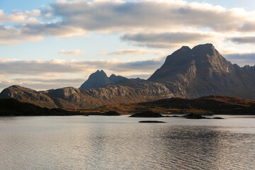 Mountain peaks in Norway's Lofoten Islands, open landscape under a silver sky © WeźTylkoSpójrz