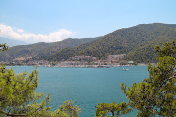 Naklejka premium View of Fethiye marina and houses from the seaside on a sunny day