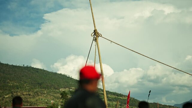 Wooden poles and ropes form traditional swing during Festival, Farwest Nepal