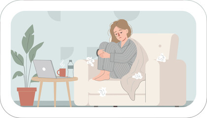 Fototapeta premium Ill woman wearing pajamas sits curled up in a comfortable armchair with a blanket, tissues, and a laptop on a nearby side table.